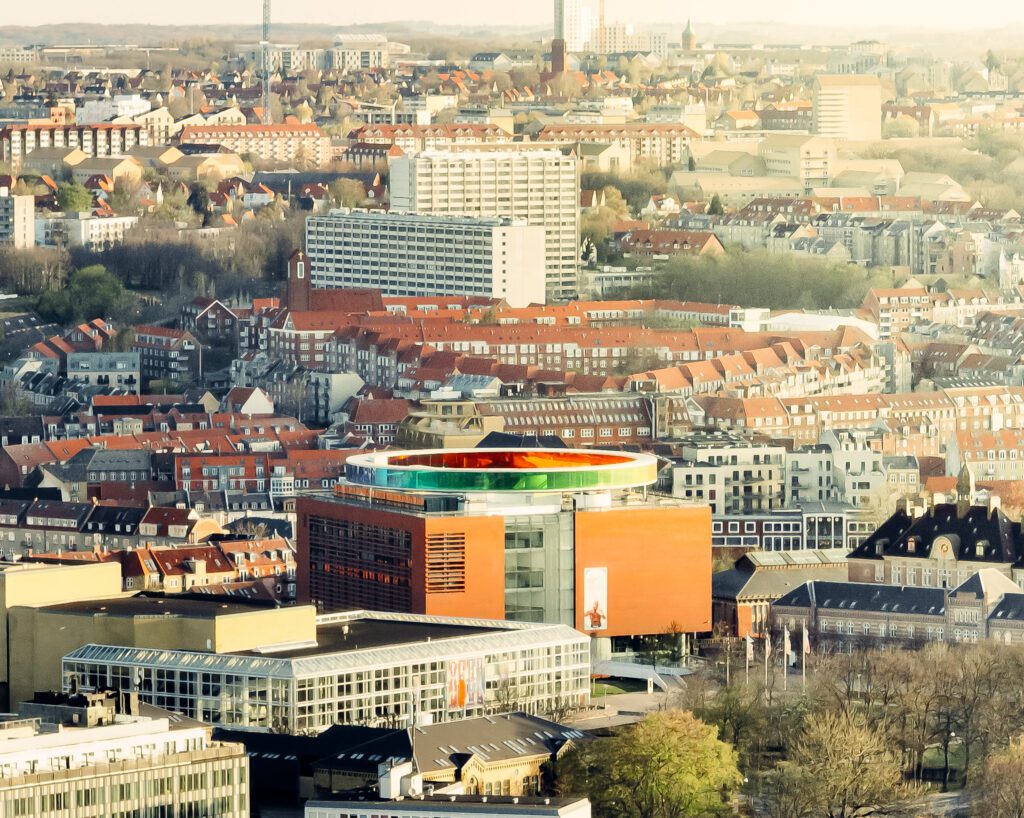 Drone shot Aarhus city Denmark. Aros Art museum Rainbow Regnbuen buildings århus