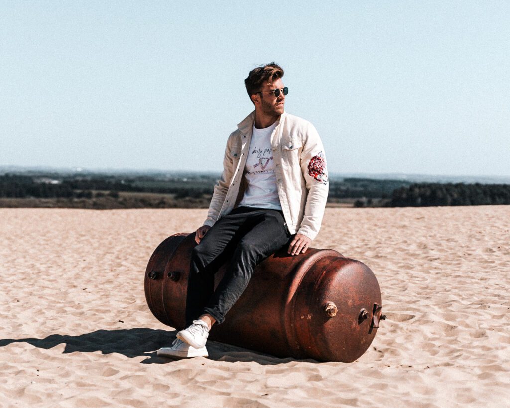 Rubjerg Knude man in the dunes in metal dunk Jutland Denmark Toop Landmark to visit Sun dunes